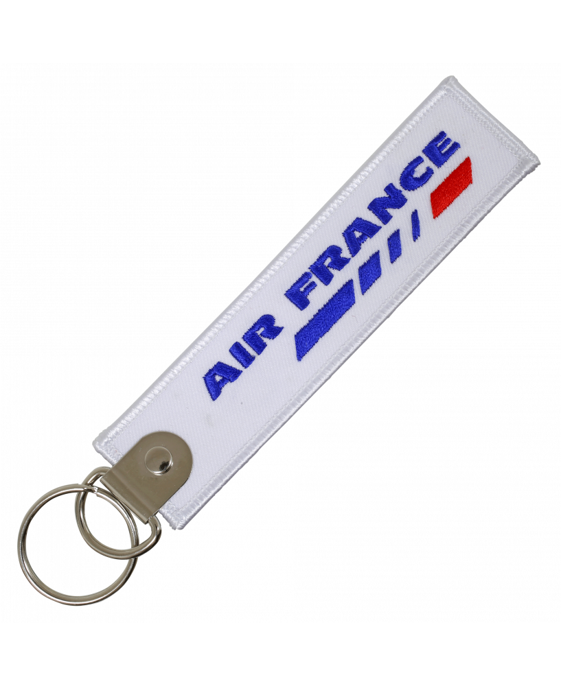 Porte-clefs reproduisant une flamme aéronautique Air France.
